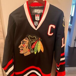 Toews Chicago Blackhawk CCM Black and Red Hockey Jersey. Size XL/52. Like new!